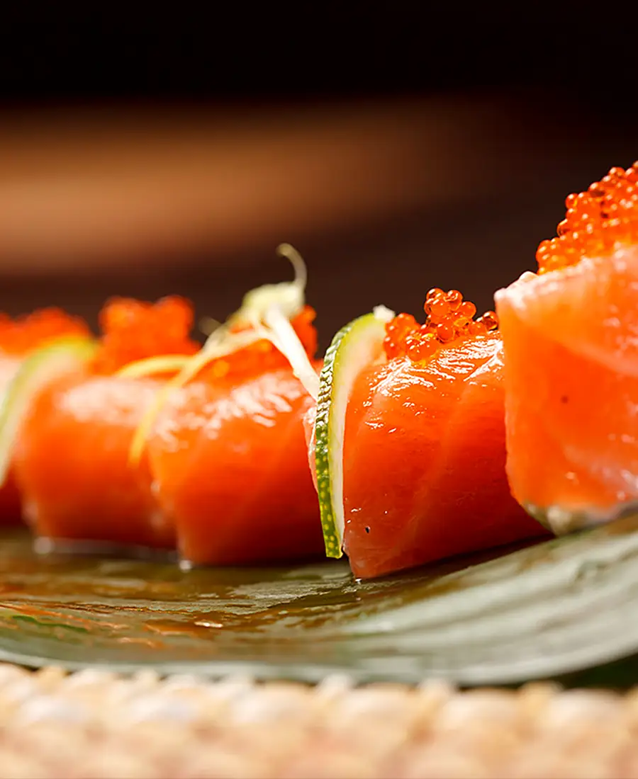 Salmon nigiri on a banana leaf
